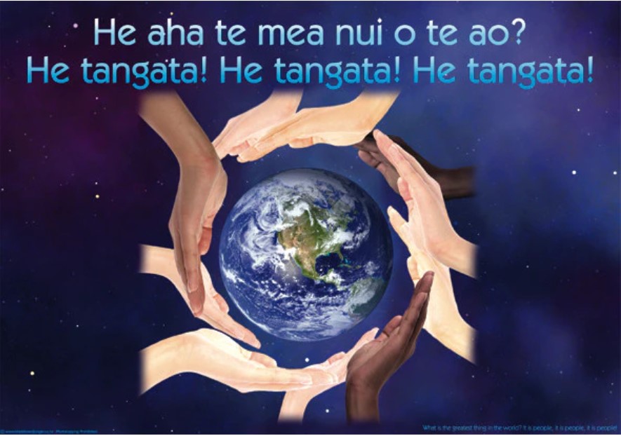 He Tangata logo, showing the globe in circle of hands of all nations